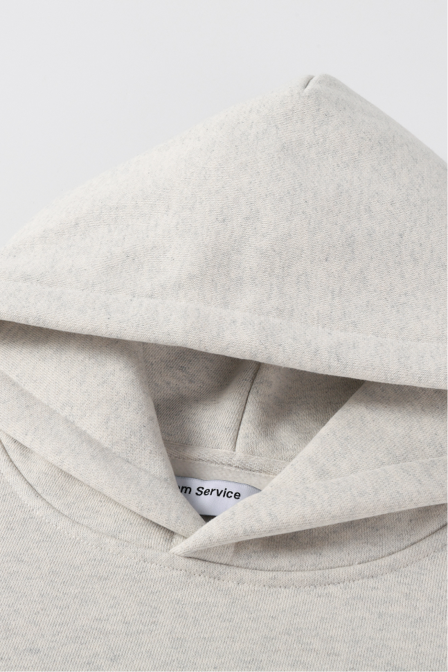 Close-up of the light heather grey hood featuring the fixed hood construction and neckline.